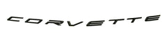 C8 Corvette rear badge close-up in glossy black for a premium look.