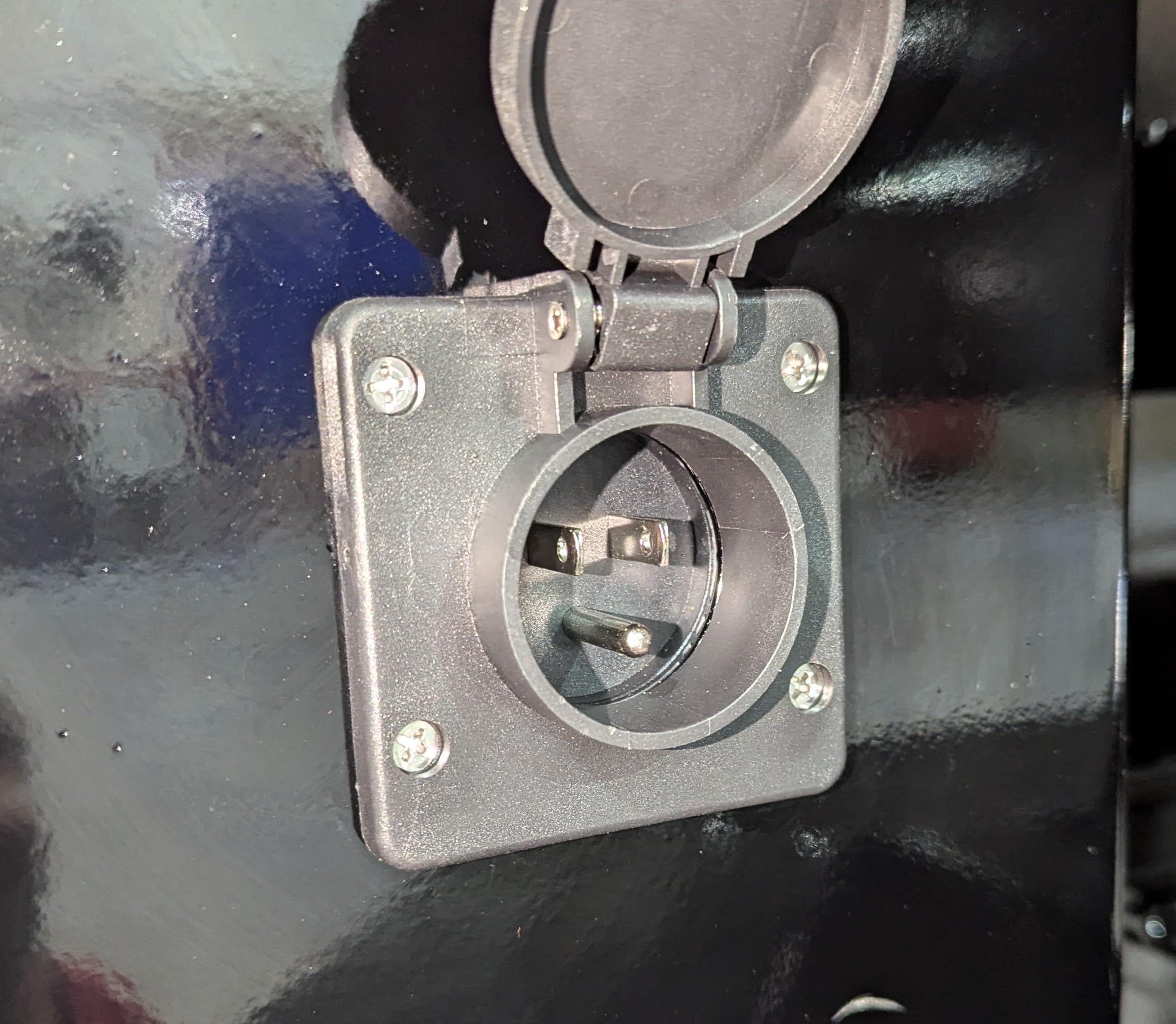 Generic integrated outlet accessibly flips open for cord extension when needed