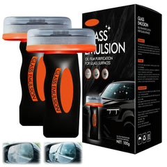 Generic oil film cleaner emulsion on windshield improves visibility in wet conditions.