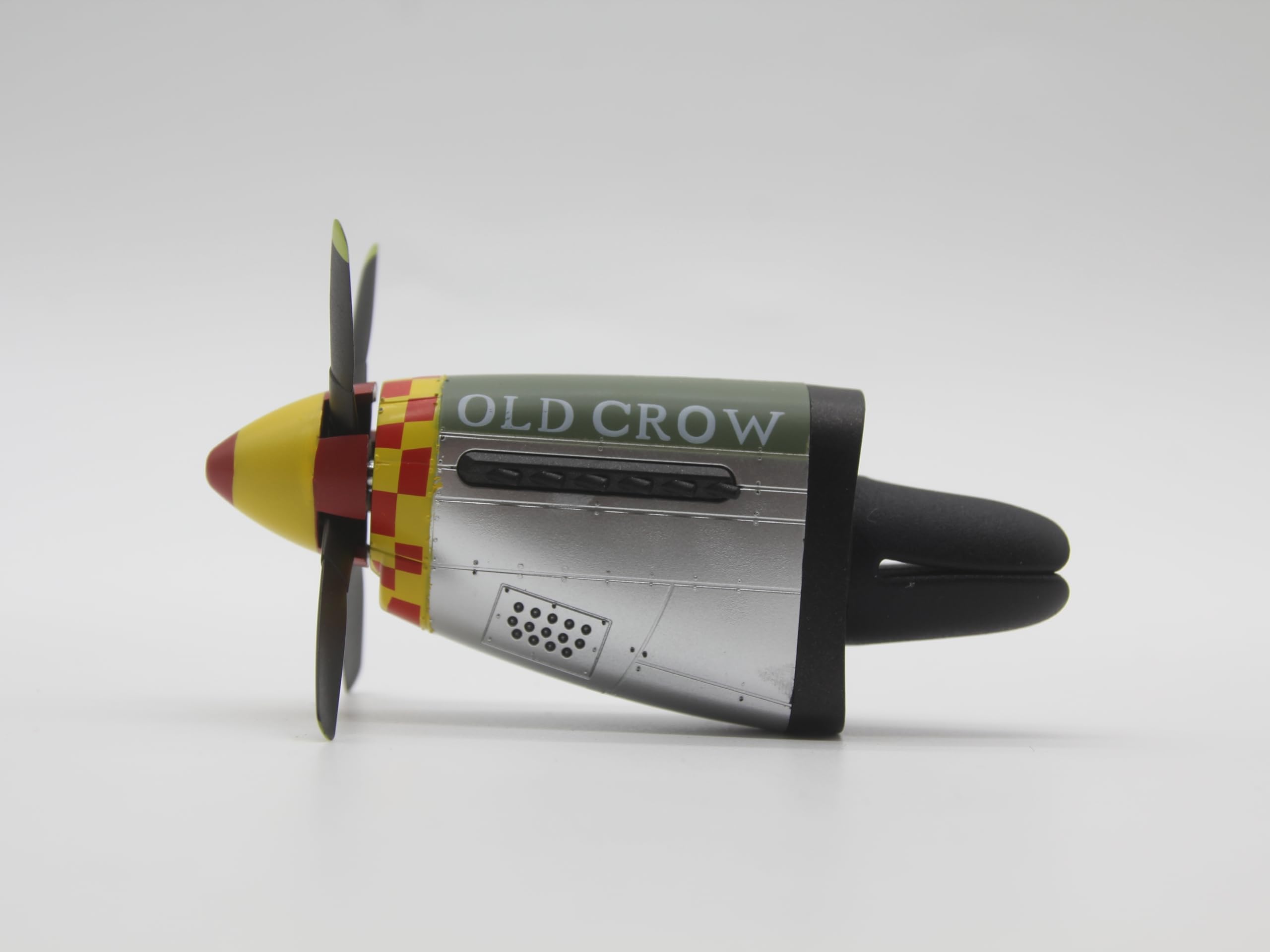 Generic P-51 Old Crow air freshener adds aviation tribute to daily commuting.