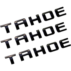 Generic Tahoe emblems front view with glossy black finish for bold styling.