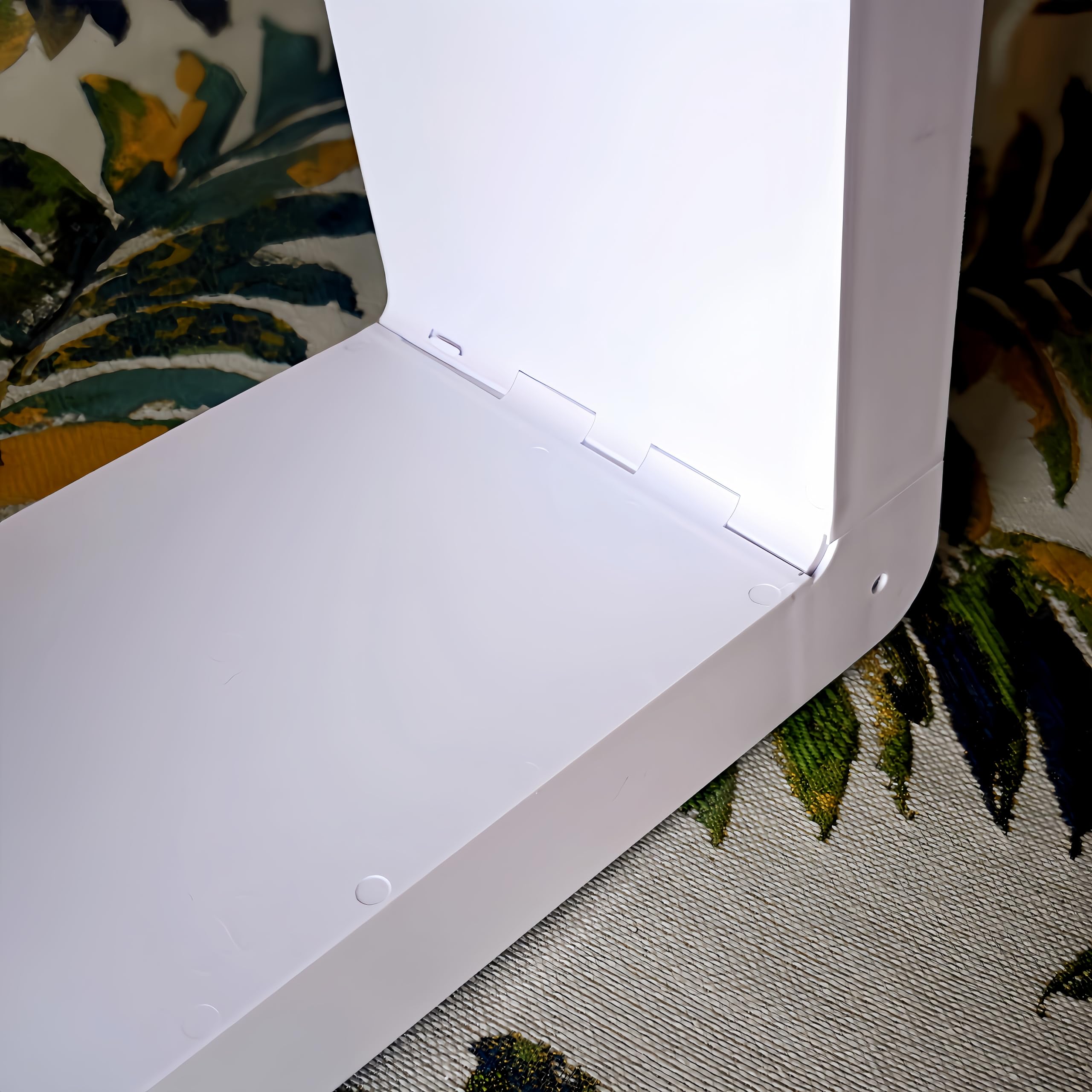 White finish garnish enhances RV interior around roof vent.