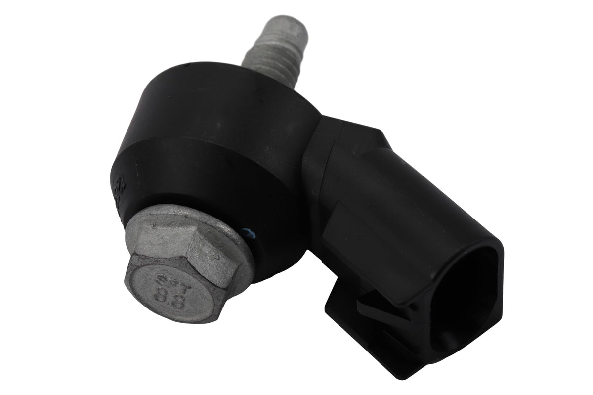 GM Genuine Parts ignition knock sensor closeup for precise engine timing adjustments.