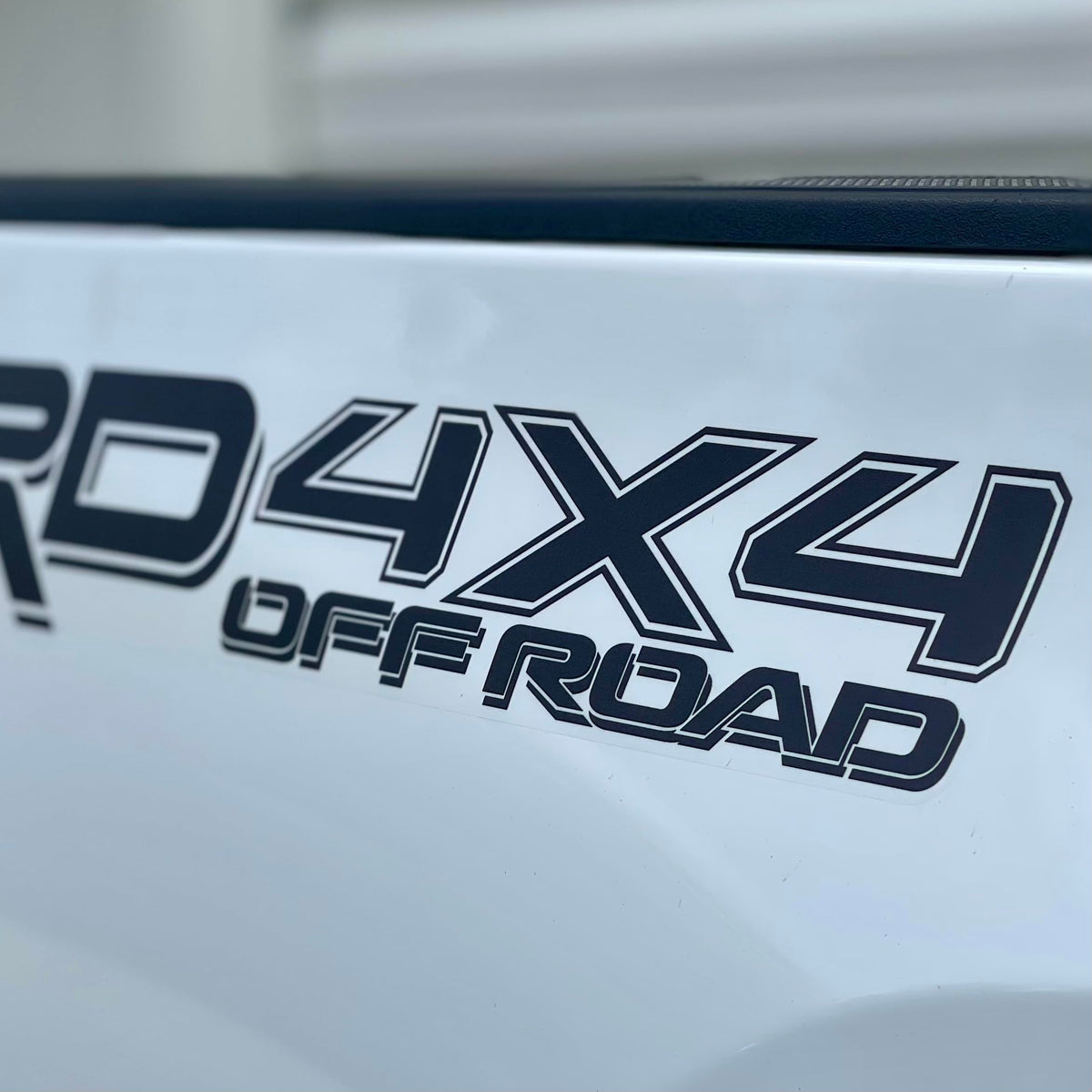 GO-GO.GROUP 4x4 offroad bedside decal closeup highlights bold matte black letters