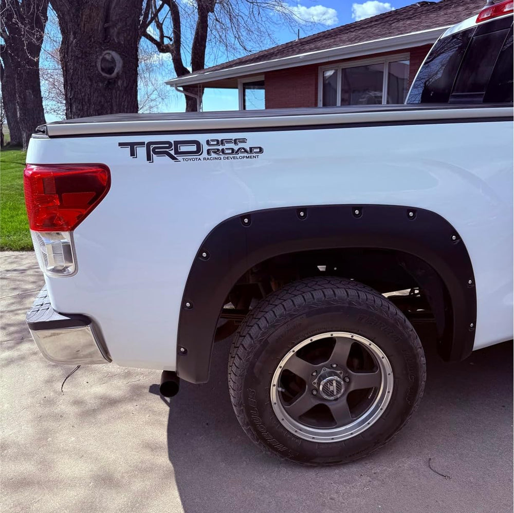 GO-GO.GROUP offroad bedside decals on a Tacoma or Tundra, bold matte black/red graphics enhance rugged style