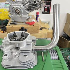 Gucididak exhaust header pipe installed on go-kart for easy upgrade.