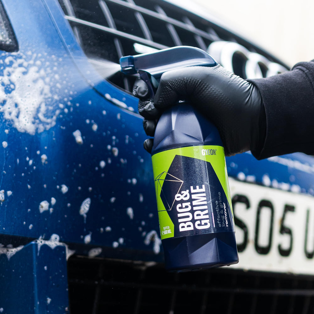 Gyeon cleaner being wiped with microfiber for streak-free shine.