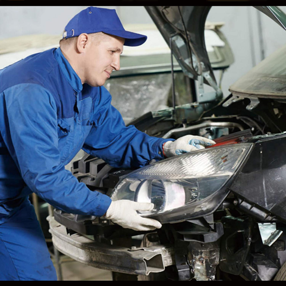 Hedume handheld brake pad tool in use during car maintenance.