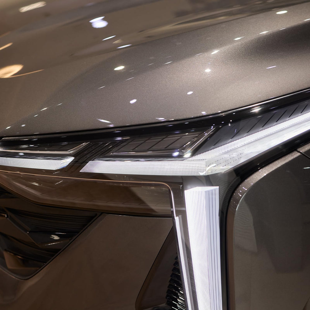 Heinaroman charcoal-grey wrap enhances car aesthetics with a sleek, modern look.