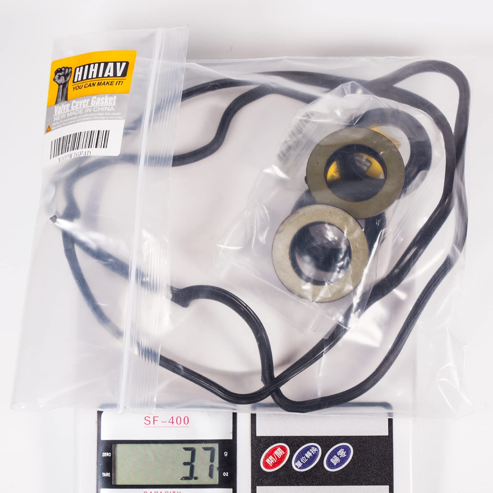 HIHIAV VS50304R1 contents include gasket and four spark plug tube seals.