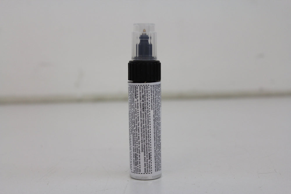 Honda Obsidian Blue Pearl touch-up paint pen cap and brush for precise scratch coverage.