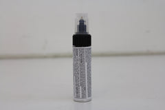 Honda Obsidian Blue Pearl touch-up paint pen cap and brush for precise scratch coverage.