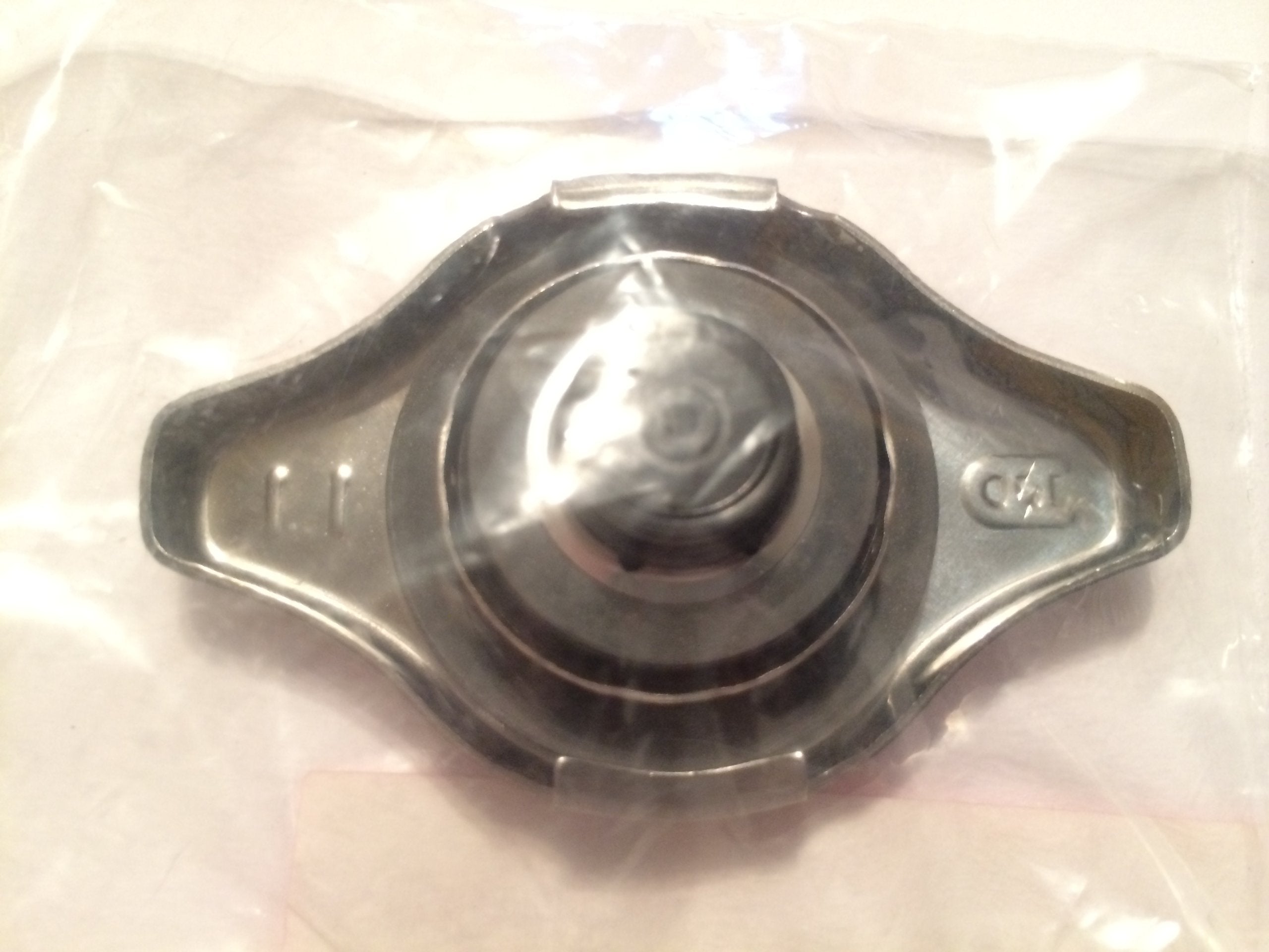 Honda radiator cap packaging shown as ready-to-install replacement part.