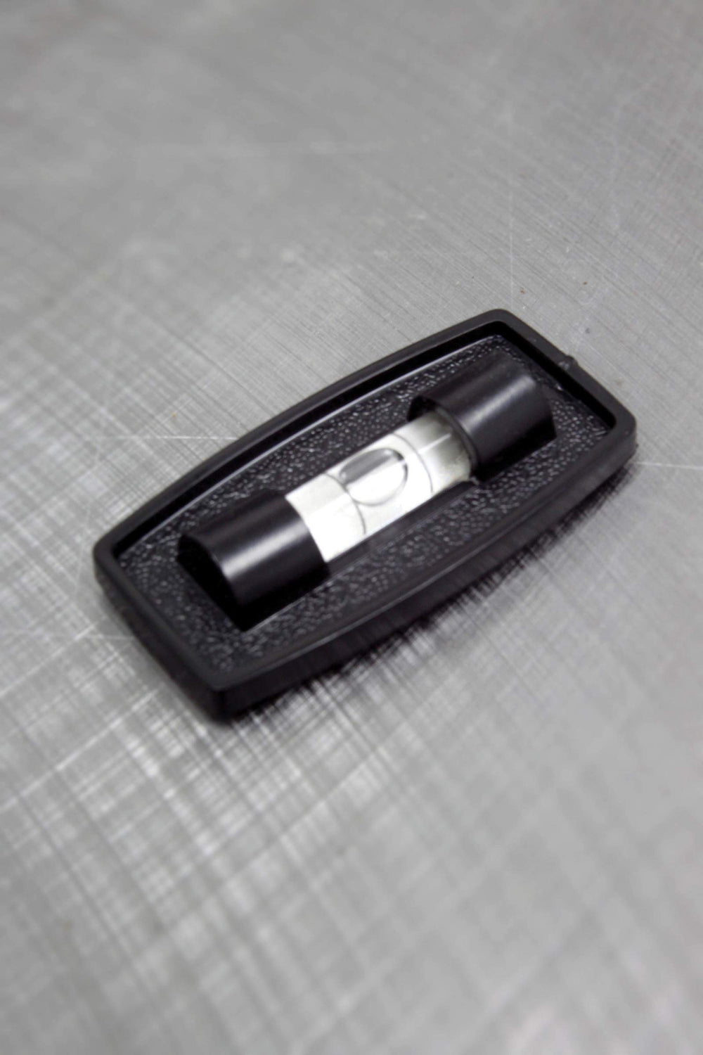 Compact, self-adhesive level ideal for quick mounting by Hopkins