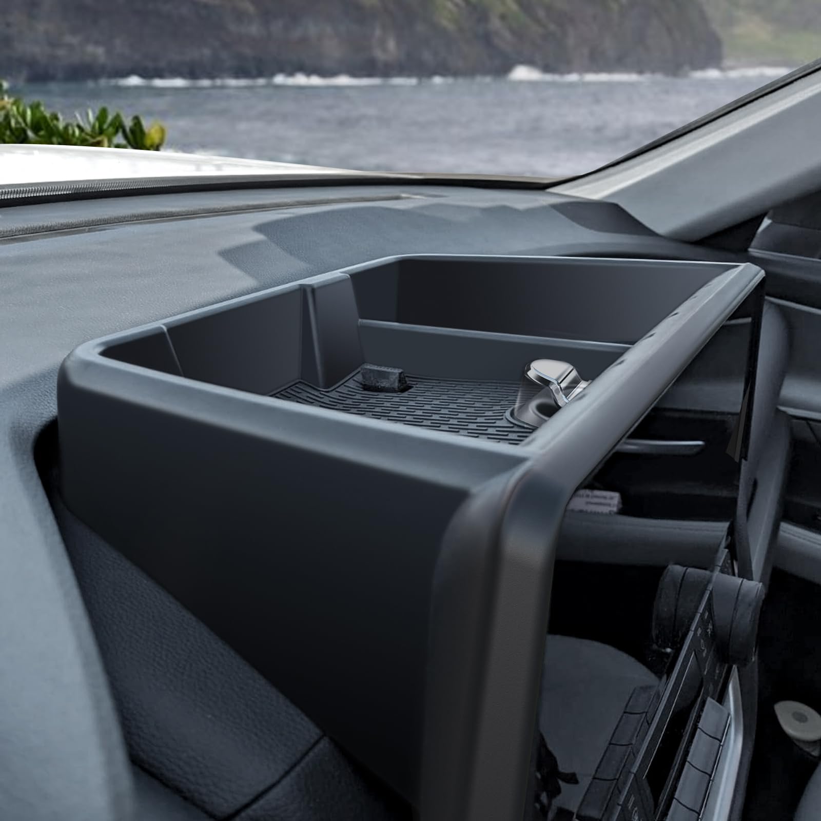 HOUCLEMIC dashboard tray beneath screen—clear organization for essential items.