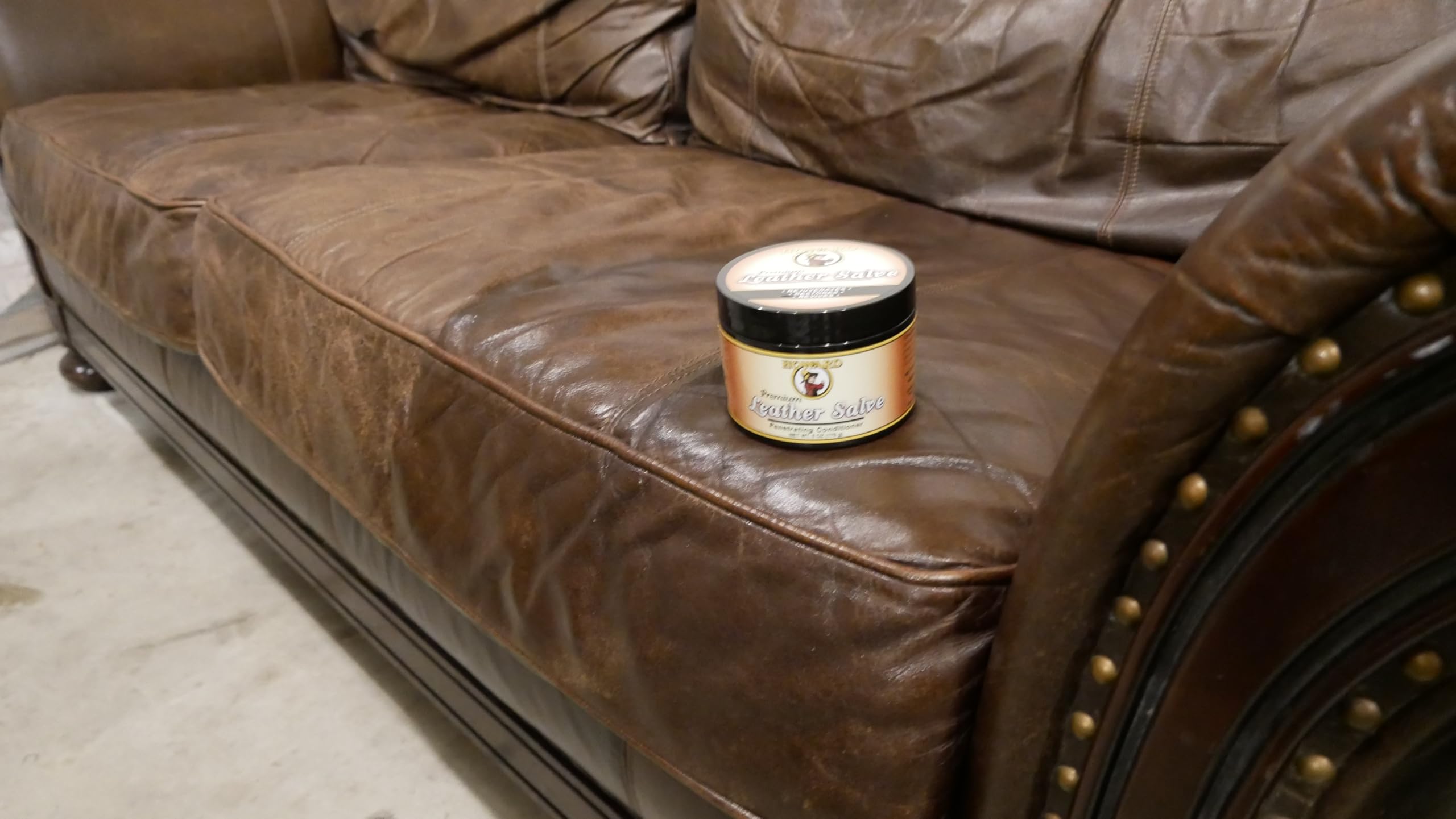 Howard Leather Salve on couch showing non greasy finish for furniture care