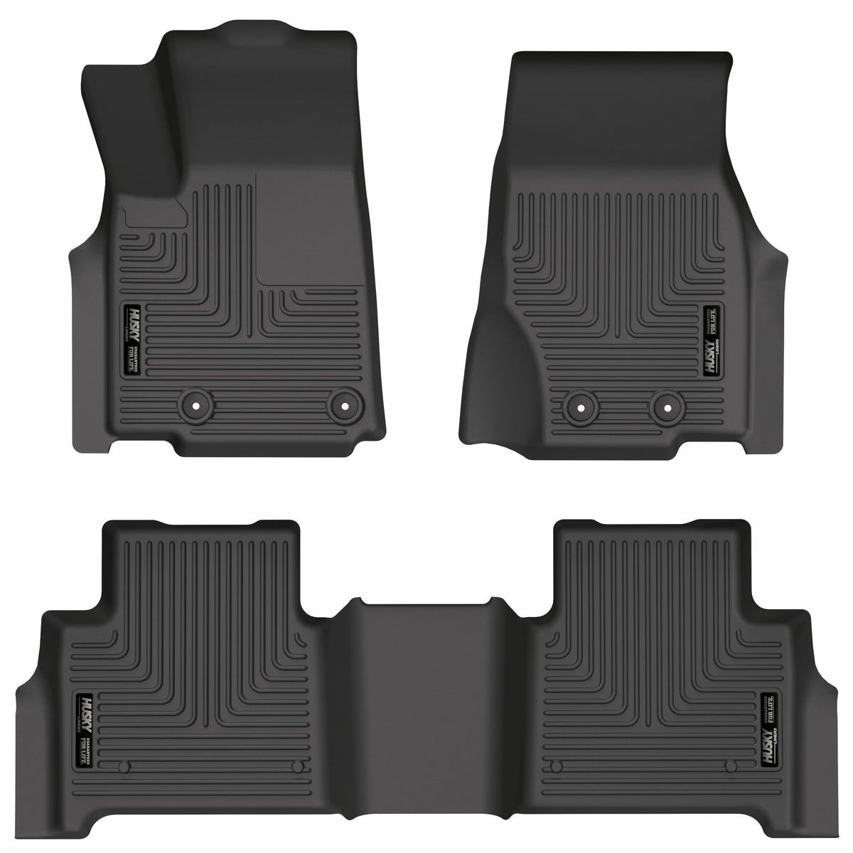 Husky Liners WeatherBeater front-row mats on a Jeep Grand Cherokee showing edge-to-edge protection