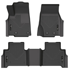 Husky Liners WeatherBeater front-row mats on a Jeep Grand Cherokee showing edge-to-edge protection