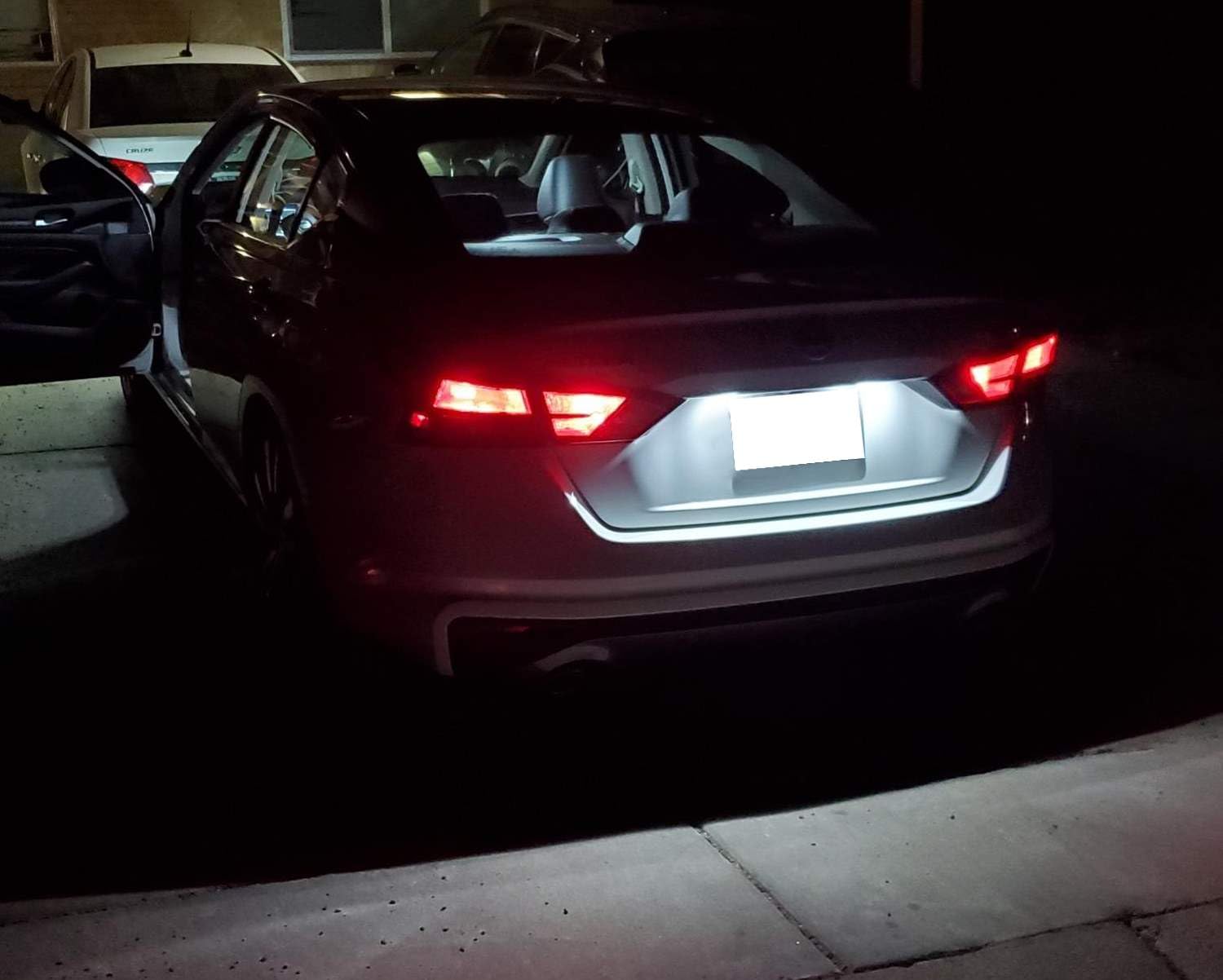 iJDMTOY license plate light installed in trunk area during upgrade.