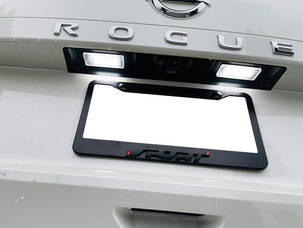 iJDMTOY xenon white LED license plate kit on Nissan Versa enhances plate illumination.