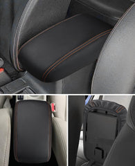 INTGET Crosstrek Impreza armrest cover close-up highlights orange stitching and durable leather.
