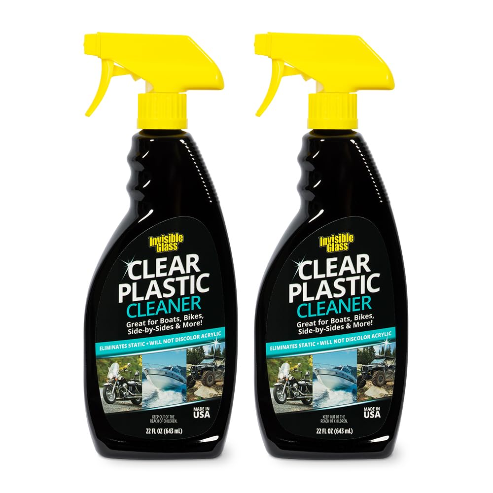 Invisible Glass clear plastic cleaner on car windshield for streak-free clarity.