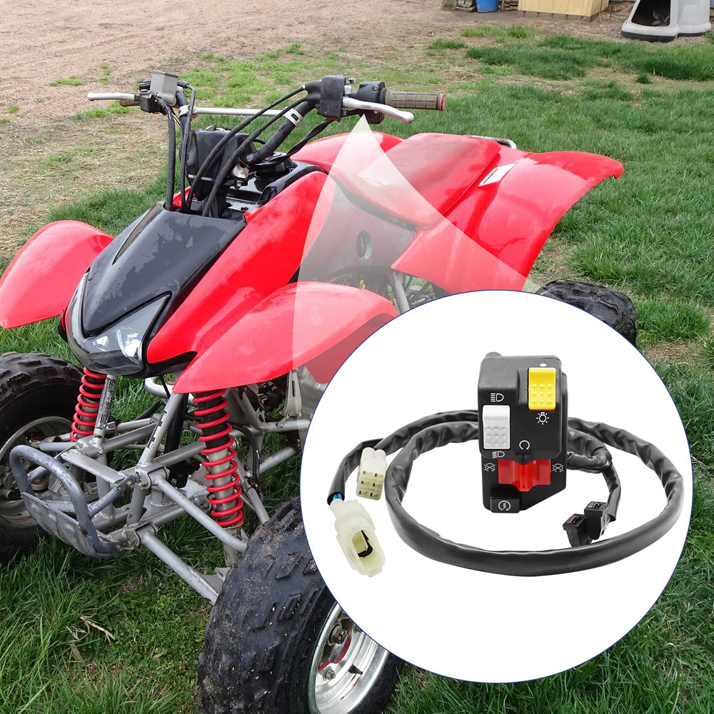 Installed JAVIK handlebar switch on a Honda TRX400EX, ready for trail use.