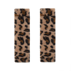 JINXU leopard seatbelt cover pad enhances comfort during car rides.