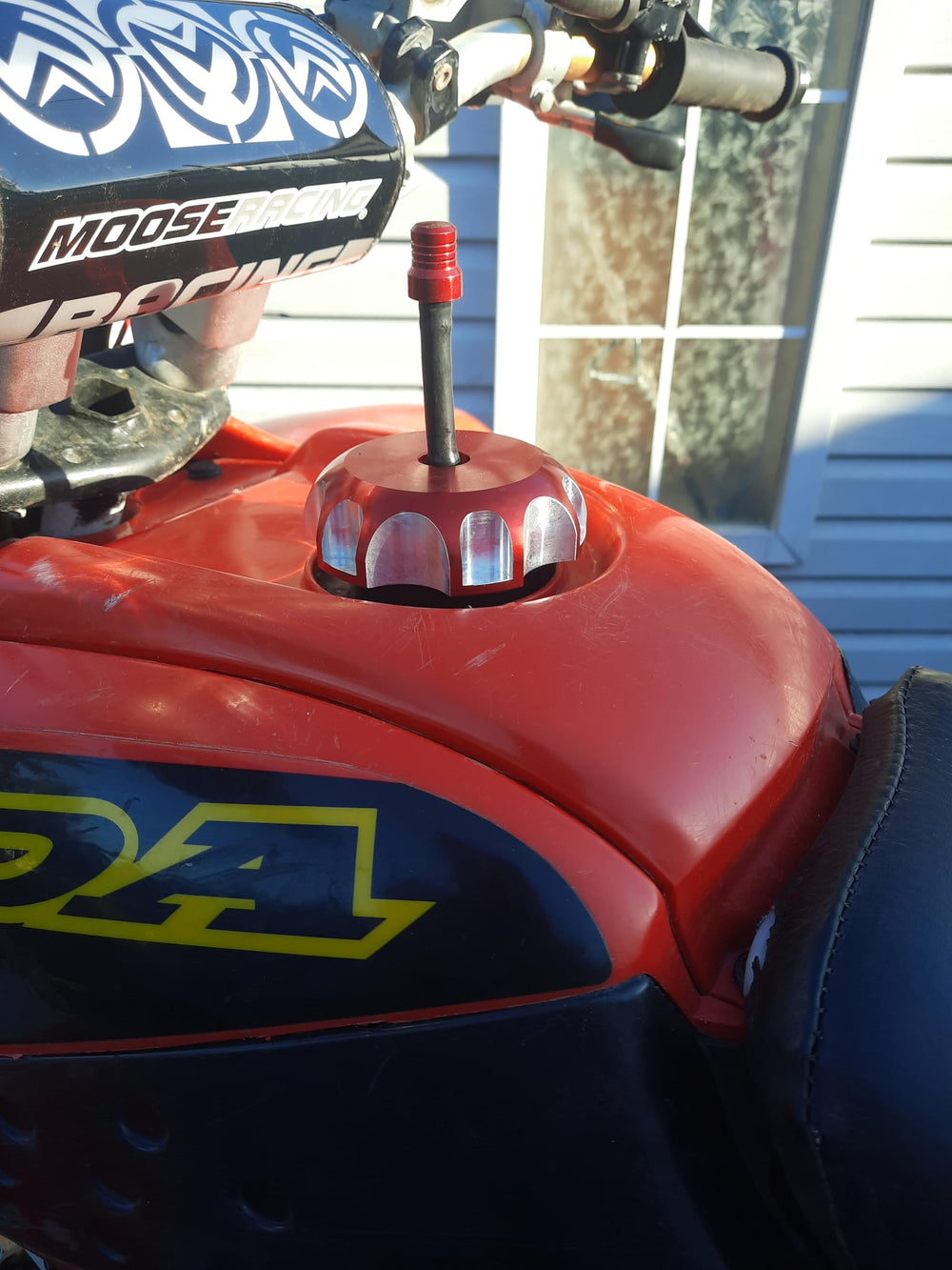 JRL tank cap cover mounted on Honda CRF showcases secure fit and protection