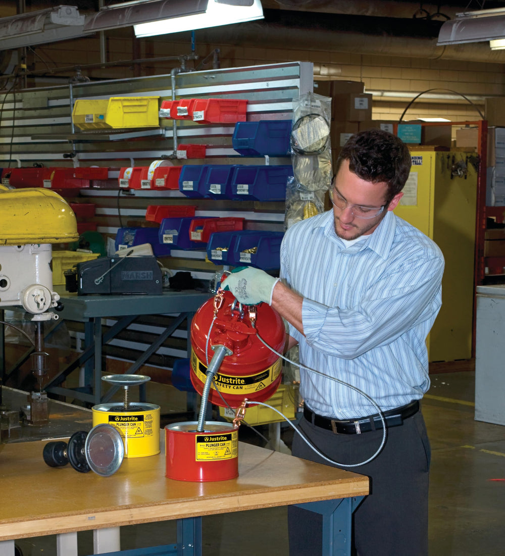 Justrite safety can with self-closing lid for leak prevention and quick pouring.