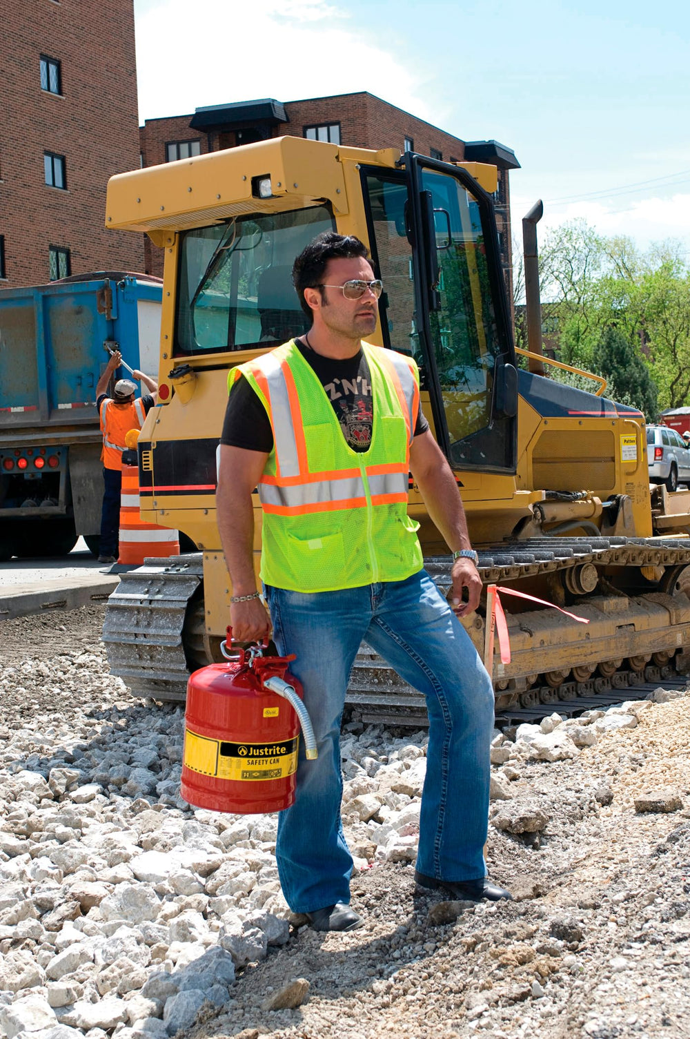 Justrite Safe-Squeeze trigger allows controlled pouring with reduced spill risk.
