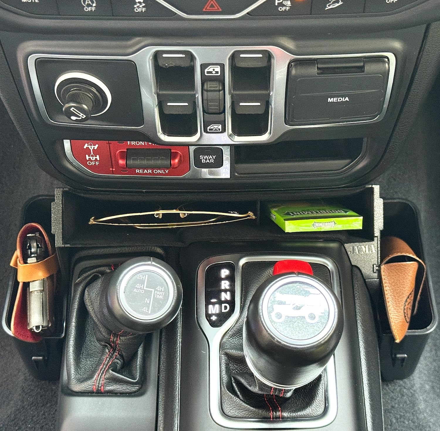 JVMA gear tray phone stand fits large phones for CarPlay use.