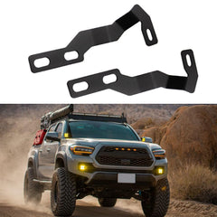 KANGIKX hood hinge ditch light bracket on a Toyota Tacoma for improved nighttime visibility