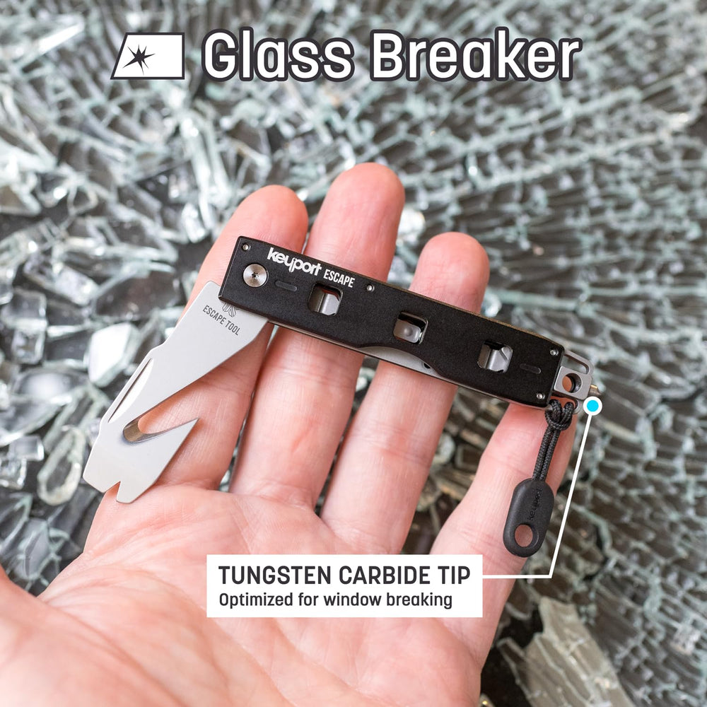 Keyport seatbelt cutter with razor edge designed for nylon straps.