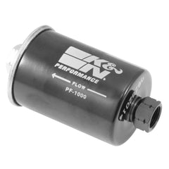 K&N PF-1000 gasoline fuel filter in engine for clean fuel delivery.