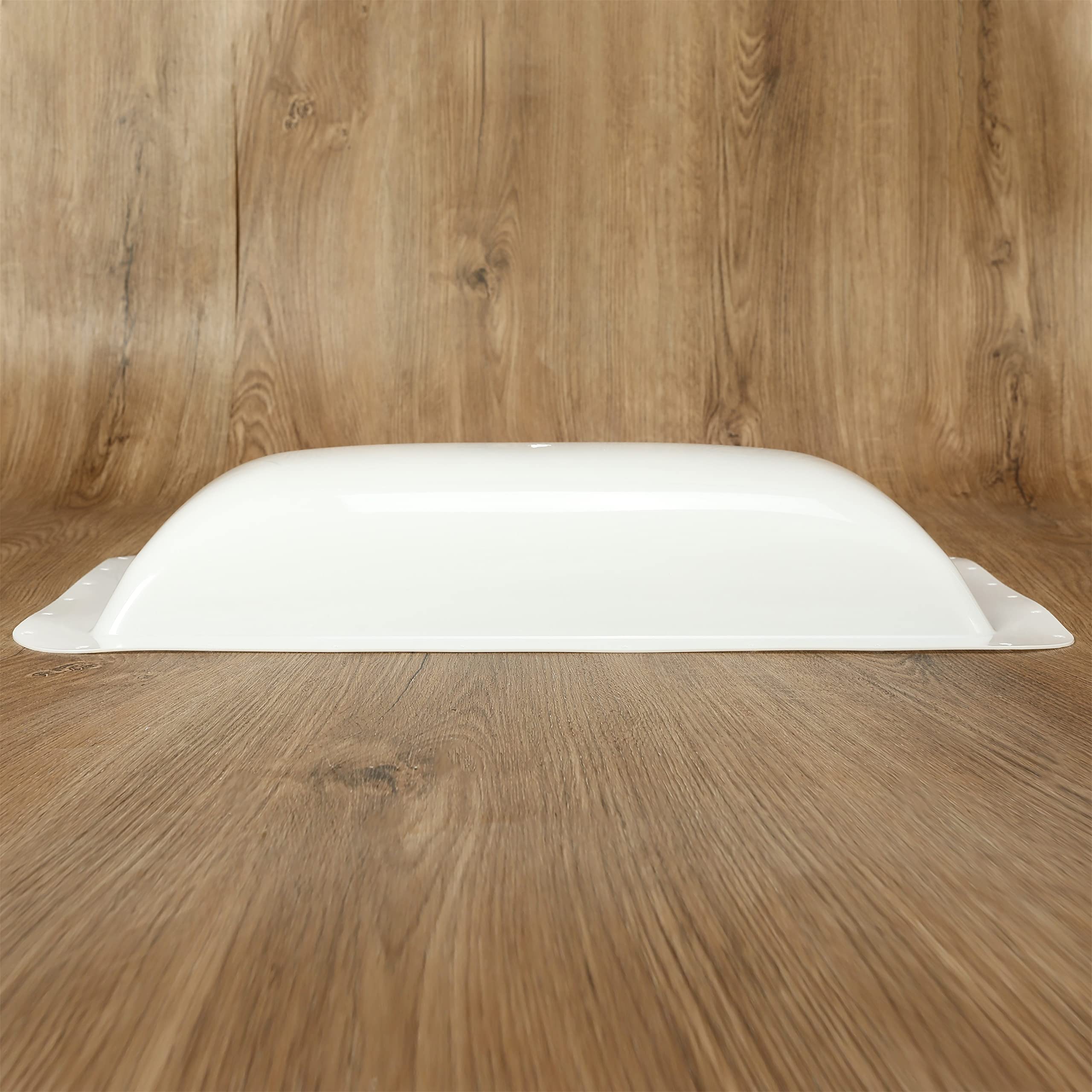 Kojem skylight cover brightens interiors while filtering harsh sun.