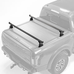 KOKSHELY 65-4 inch cross bars installed on a mid-size truck for versatile hauling.
