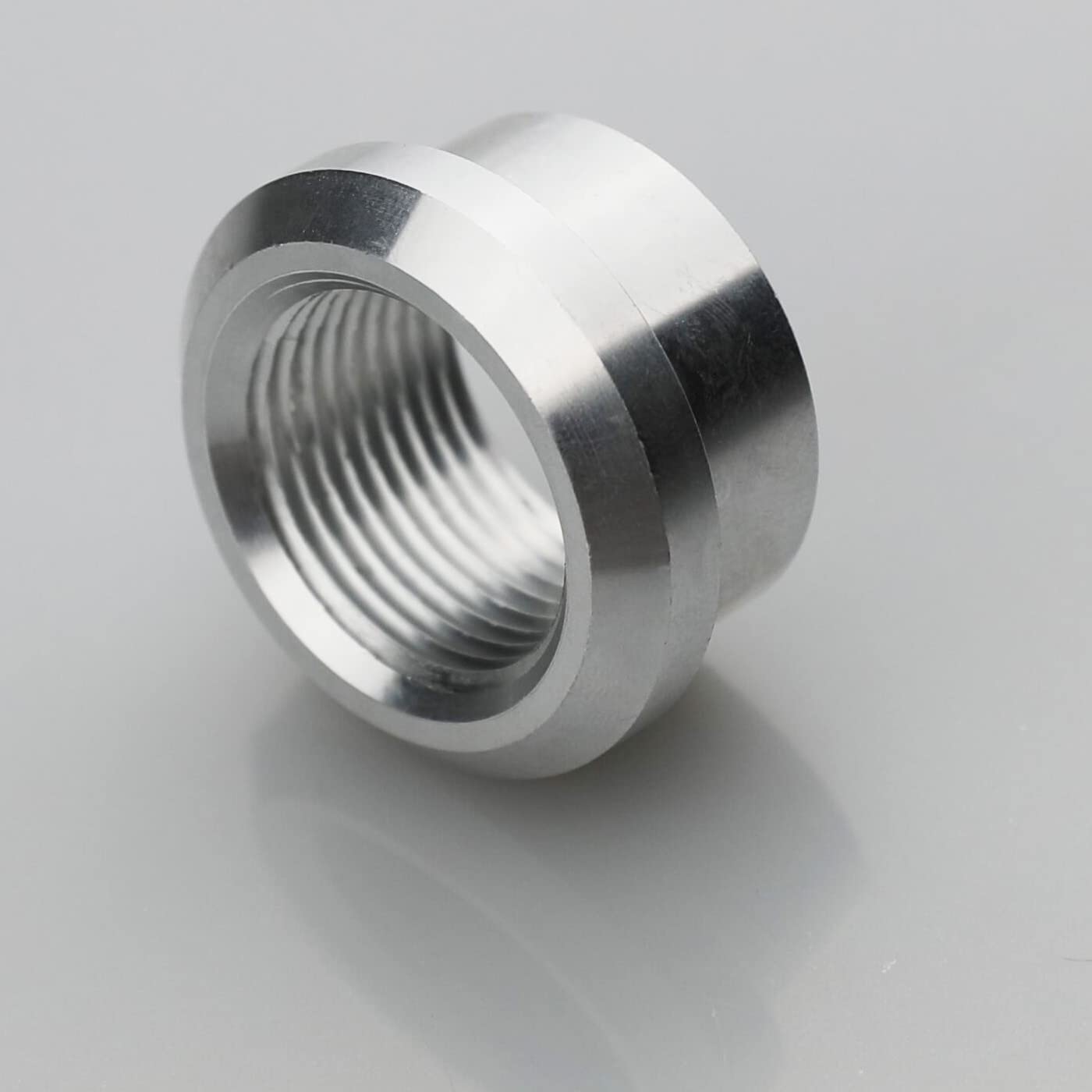 KRD PERFORMANCE weld-on bung shown in automotive context for fuel, oil, or intercooler piping.