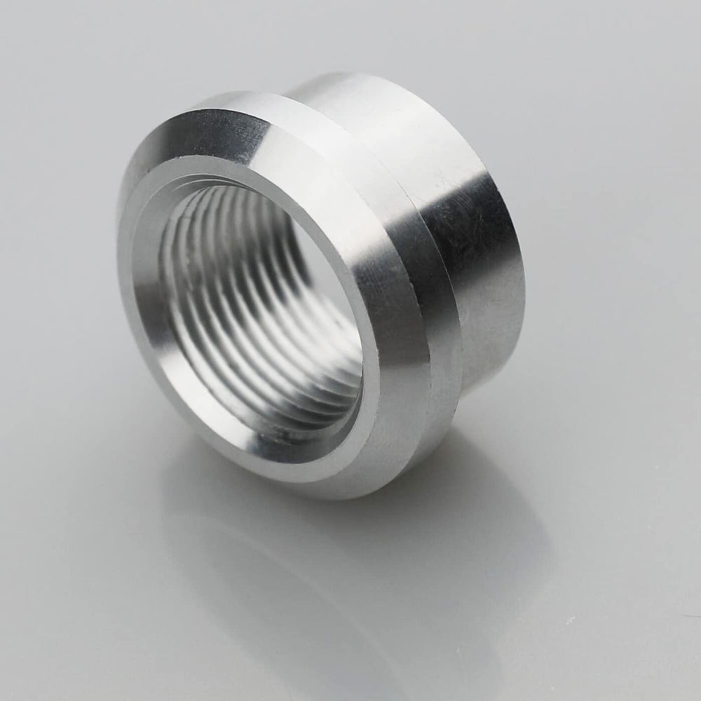 KRD PERFORMANCE weld-on bung shown in automotive context for fuel, oil, or intercooler piping.