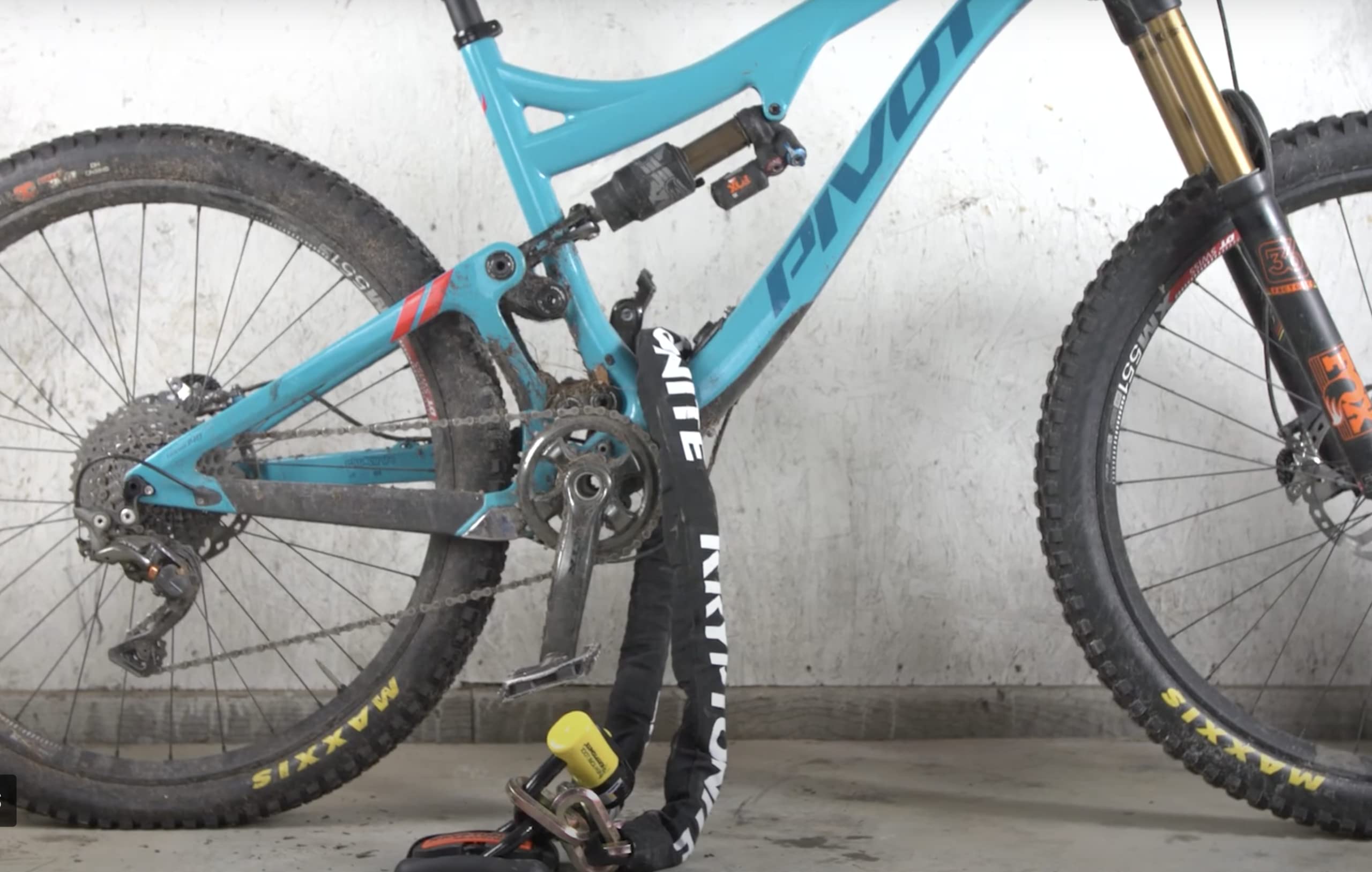 Kryptonite Evolution Ground Anchor in-use demonstrates secure attachment for bikes and e-bikes.