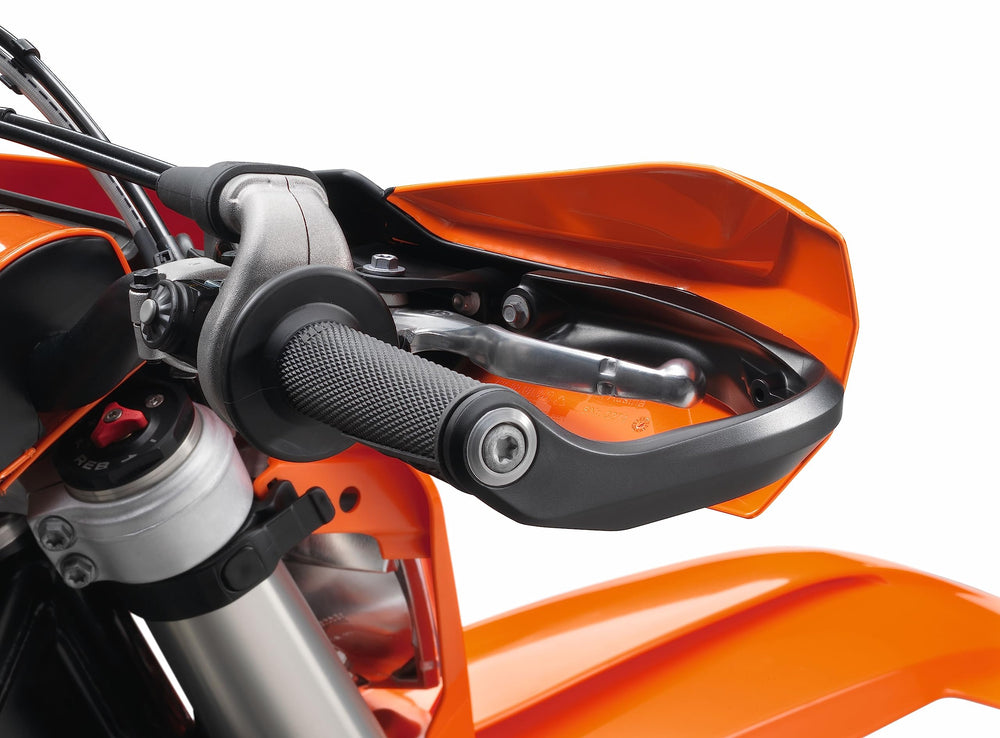 KTM wrap-around hand guard kit in use, durable protection during aggressive off-road sessions.