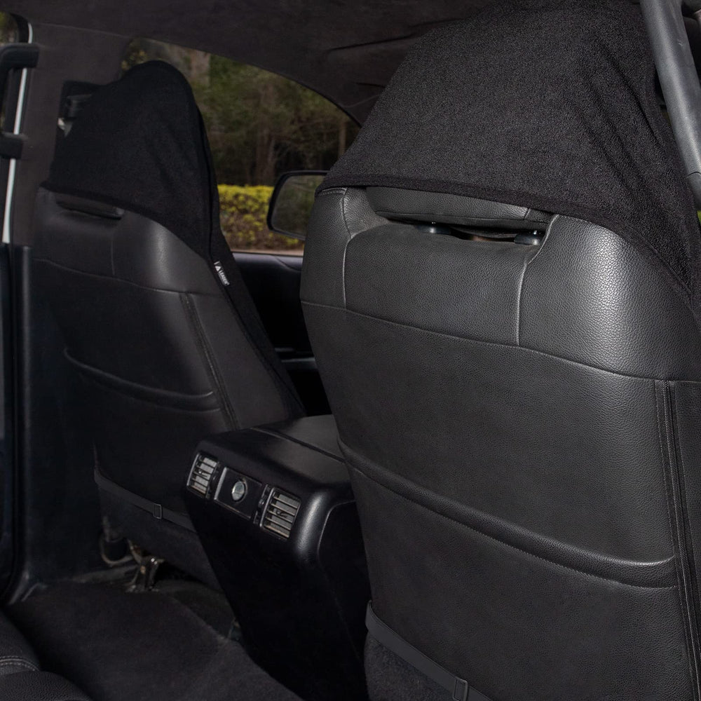 Leader Accessories two-pack front-seat covers shown rolled for compact storage.