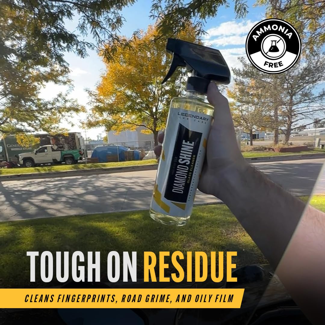 Legendary Glass Cleaner being sprayed on a windshield for spotless results.