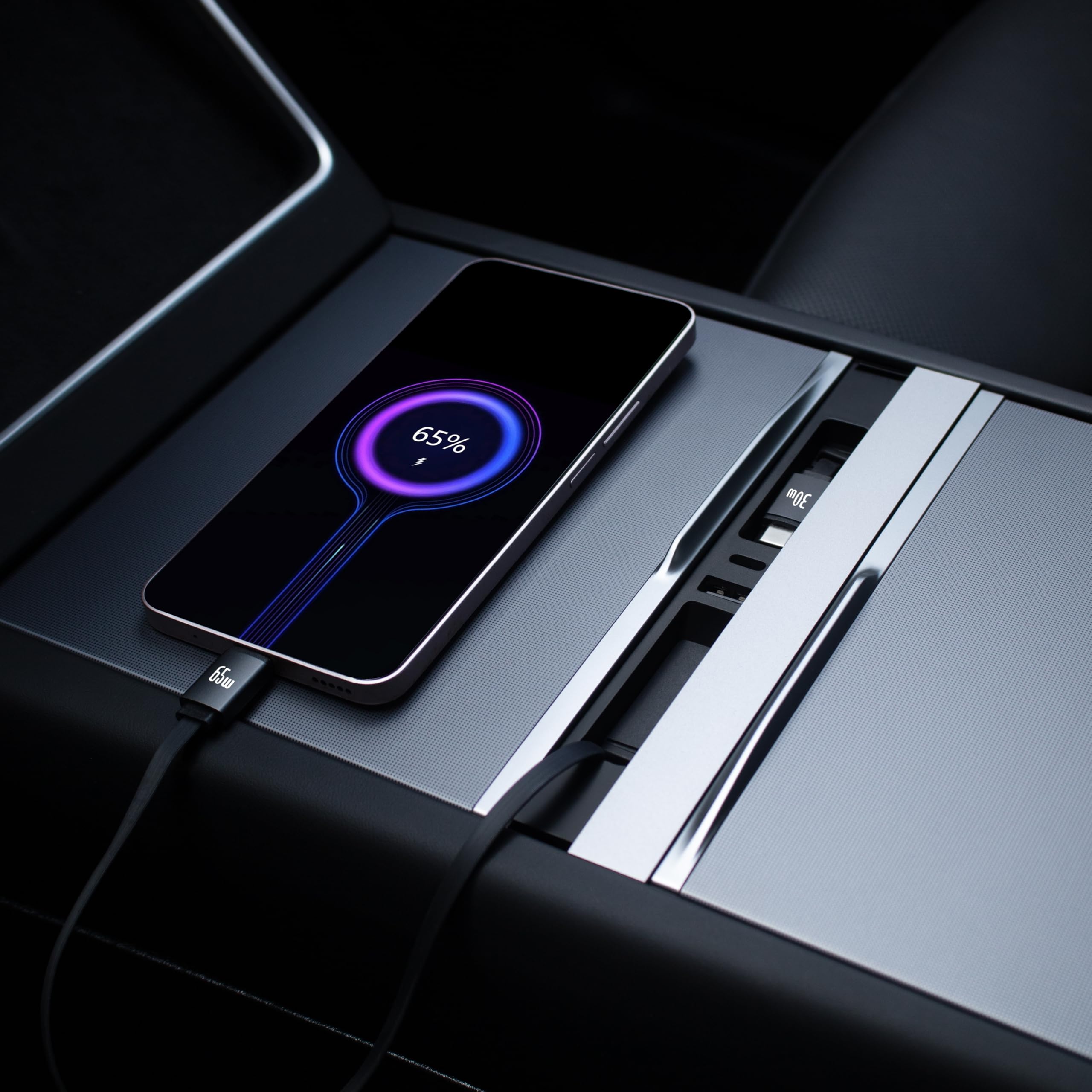 Installable Leikaendi hub fits neatly under the Tesla center console.