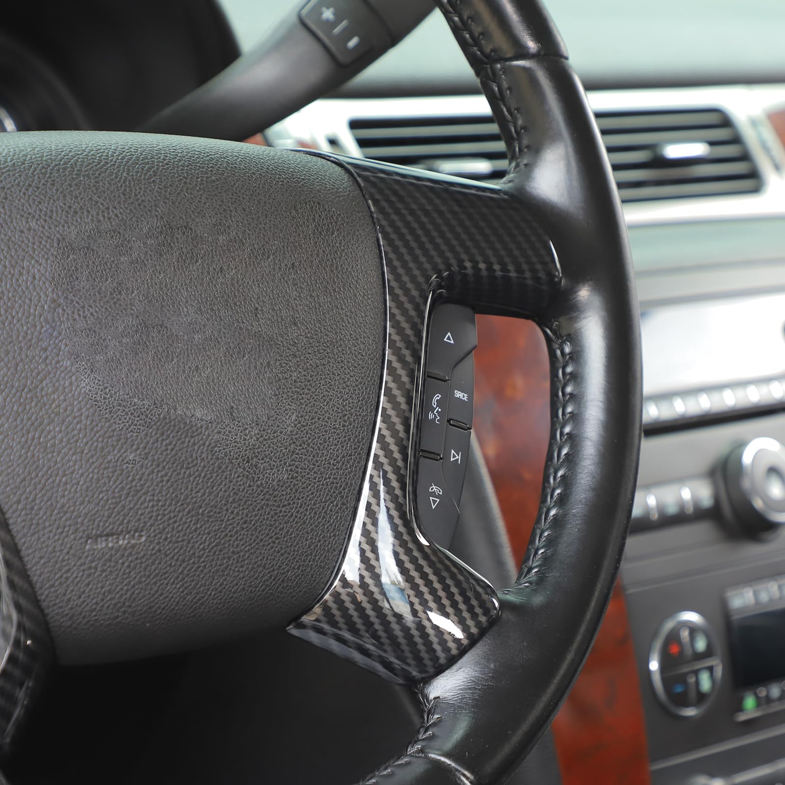 Linskip steering wheel cover on Tahoe/Traverse for improved grip and modern look.