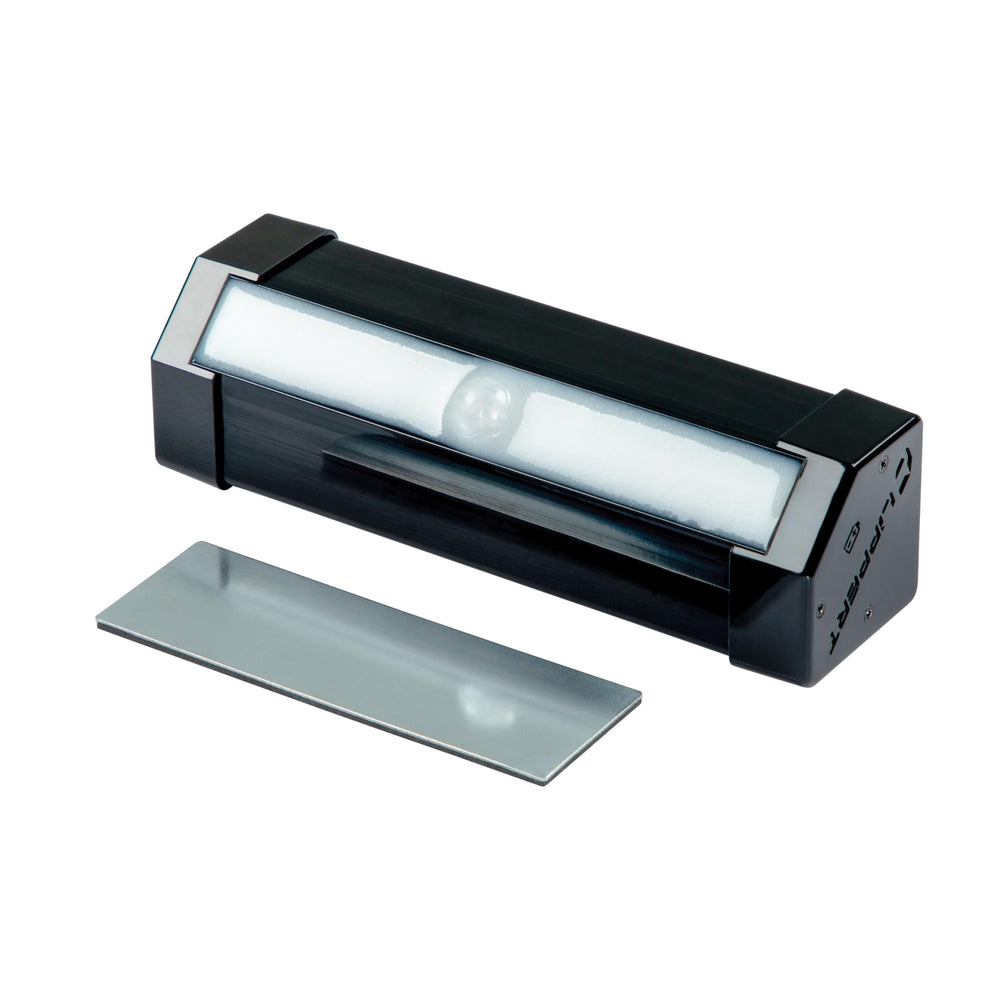 Lippert RV step light with magnets attaches quickly to stairs for easy setup.