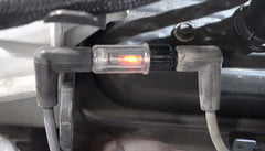 Lisle spark tester boot-ends in action shows spark between plug and wire.