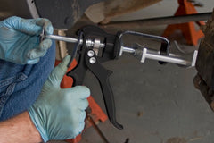 Lisle 25750 plunger-contact inboard pad shows compression of both pistons.