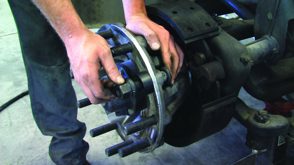 Lisle 28950 installed on truck wheel for precise alignment