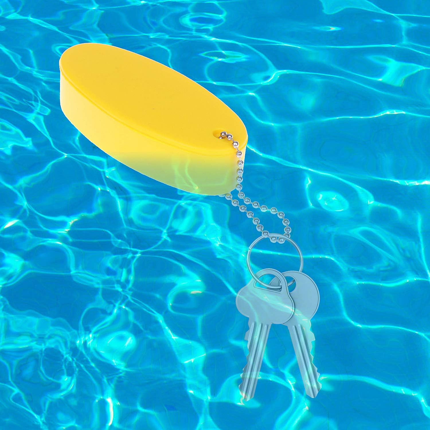 LOCOLO floating keychain in yellow aids rapid key location on sunlit days.